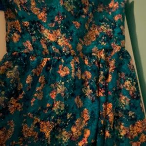 This is a mainly blue midi dress with a floral print.